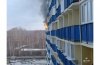 Novosibirsk firemen with difficulty pulled up to the burning house because of parked cars
